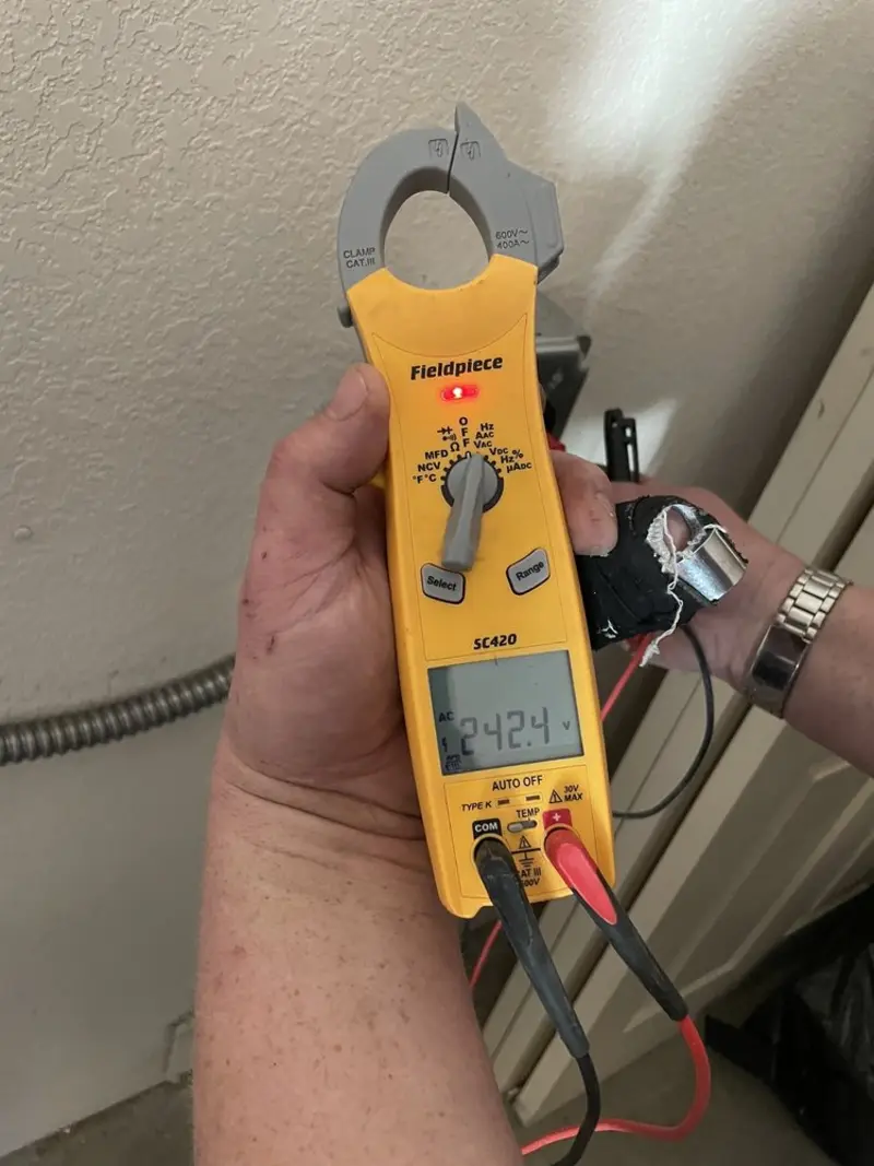 Voltage testing with clamp meter during Outlet Installation in Northfield